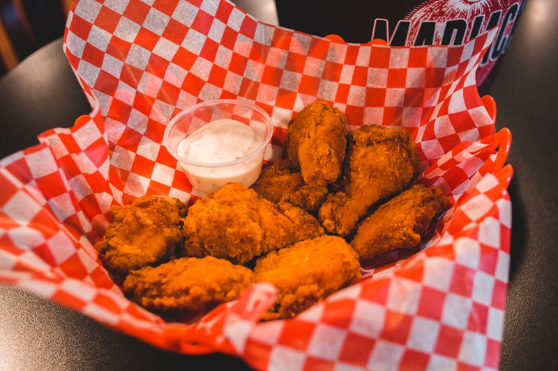 Crispy chicken wings with hot sauce and blue cheese dip